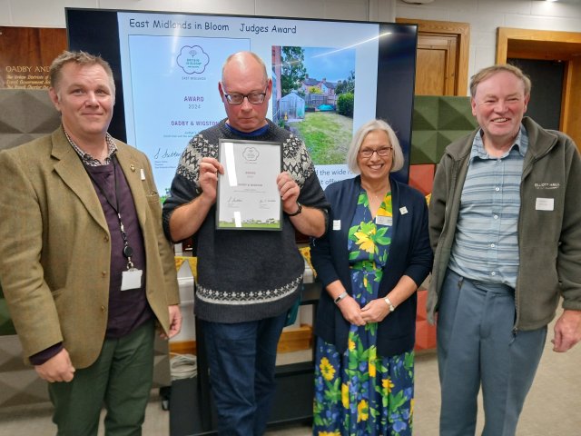 (L-R) Cllr Carl Walter (Elliott Hall), Neil Maher (Elliott Hall), EMiB judge Joyce Slater and Rob Elliott (Elliott Hall) at the presentation of the Elliott Hall judges’ award at an awards ceremony held by Pride of the Borough at the Oadby & Wigston Brocks Hill Council Offices