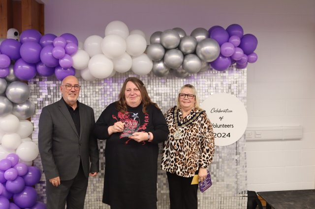 Tracey Weskamp from the Oadby 50+ Group collects her award from Mayor Clare Kozlowski (right) and Moin Durrani (left) on behalf of award sponsors Universal Flexible Packing Ltd