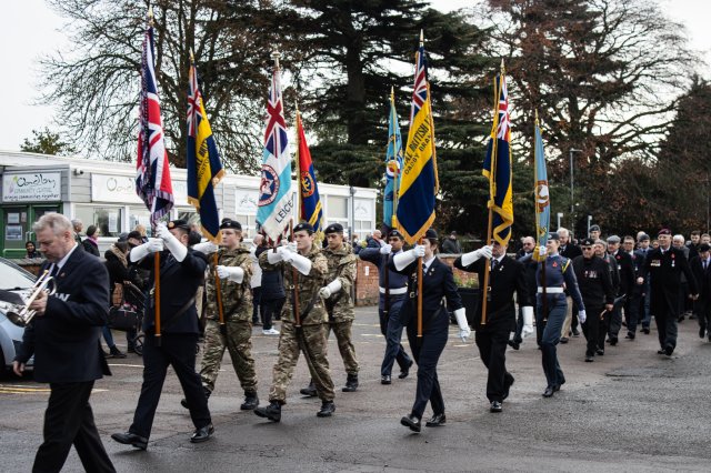 Cadets marching with flags at the Oadby Remembrance Sunday Parade